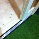 Abri toit plat Qubic de 6.05m² en bois vitrifié gris 19mm - Karibu