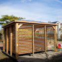 Pool house en bois thermo traité 12,31m² BLUETERM, 2 parois avec ventelles et 2 parois avec comptoirs - HABRITA