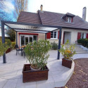 Pergola bioclimatique aluminium anthracite 10,80m² + toit avec lames ovales écru HABRITA